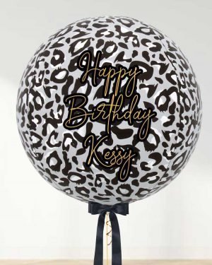 white leopard balloon with text